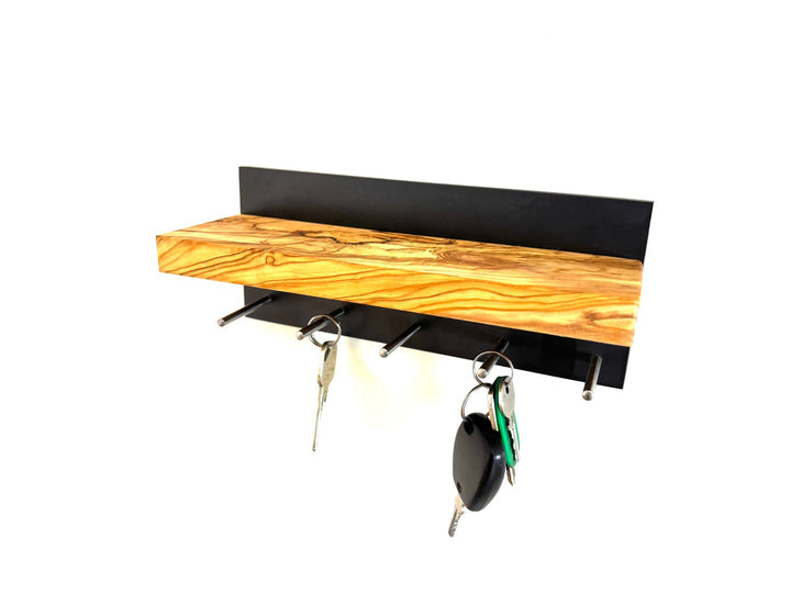 Keychain in the shape of a cross made of olive wood