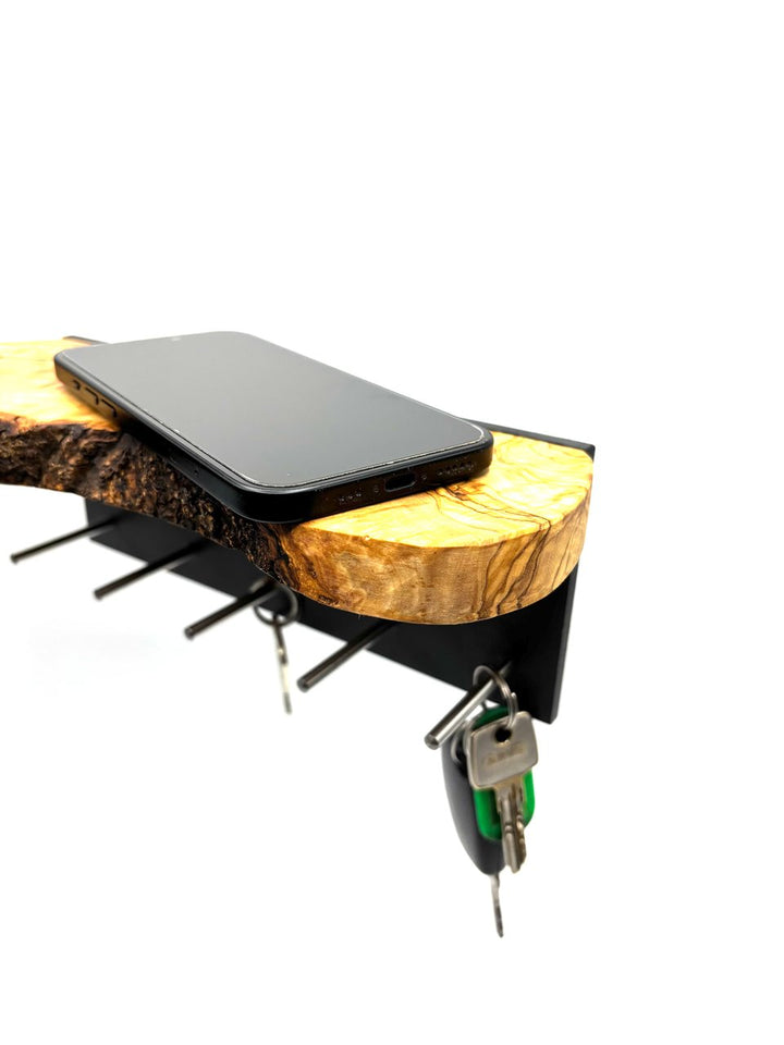 Keychain in the shape of a cross made of olive wood