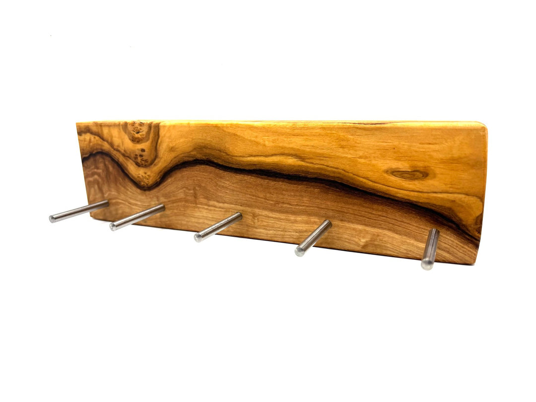 Keychain in the shape of a cross made of olive wood